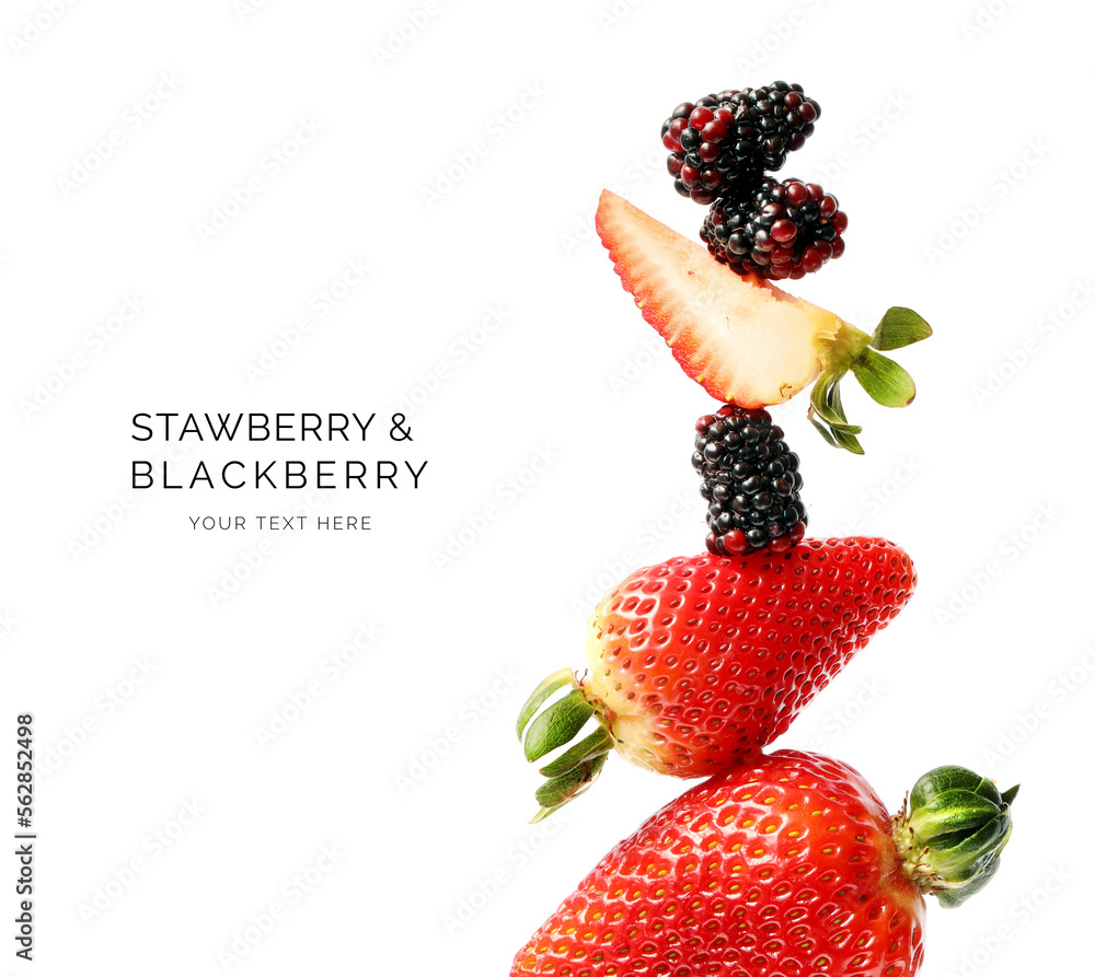 白色背景上由草莓和黑莓制成的创意布局。平躺。食物概念。