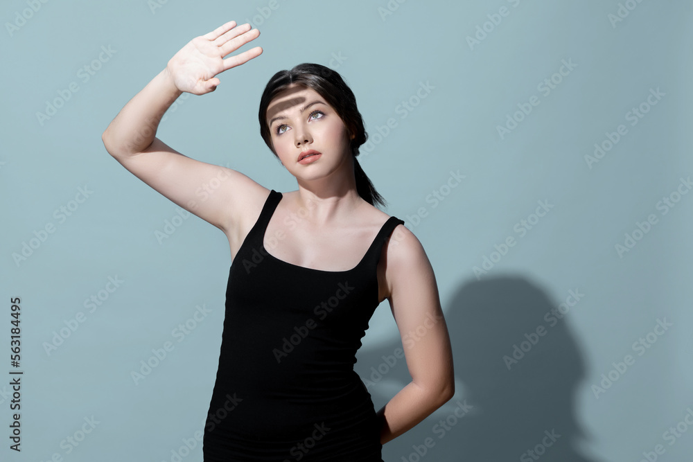 Young charming caucasian teenager girl with clean and fresh skin posing pointing fingers on empty ba