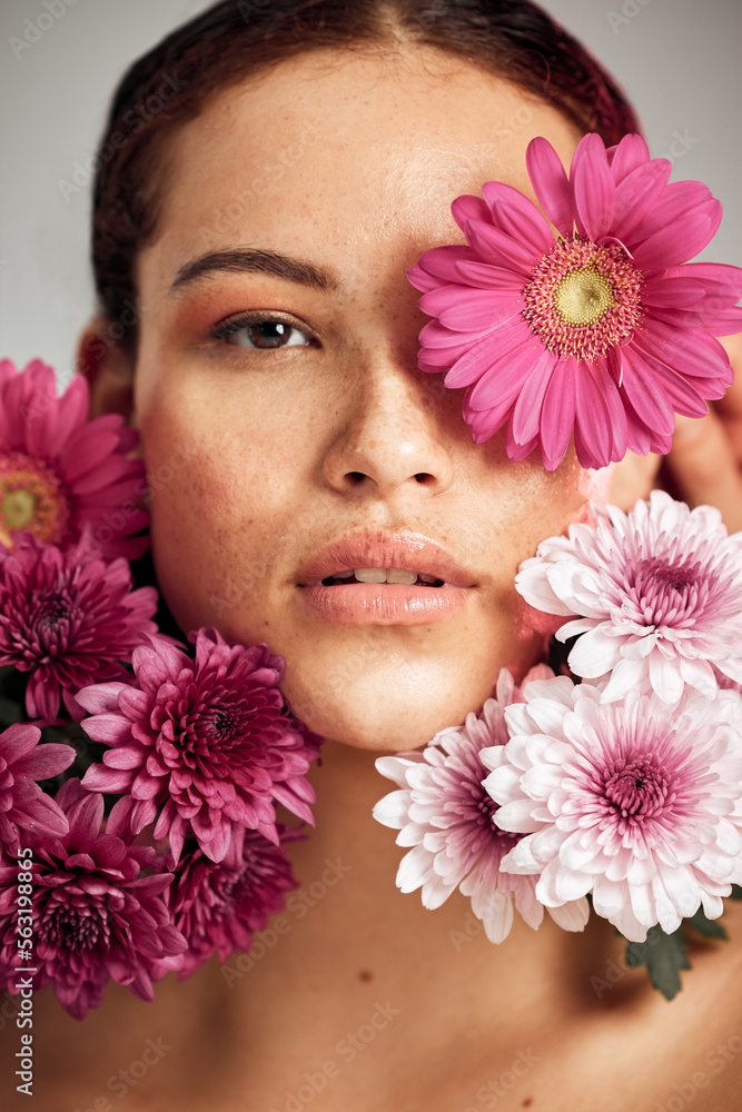 Woman, flowers and studio portrait for beauty, wellness and skincare with spring aesthetic by backgr