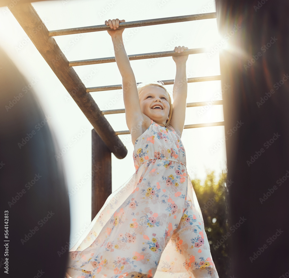 Child, happy or playing on monkey bars in park, nature garden or house backyard on holiday vacation 