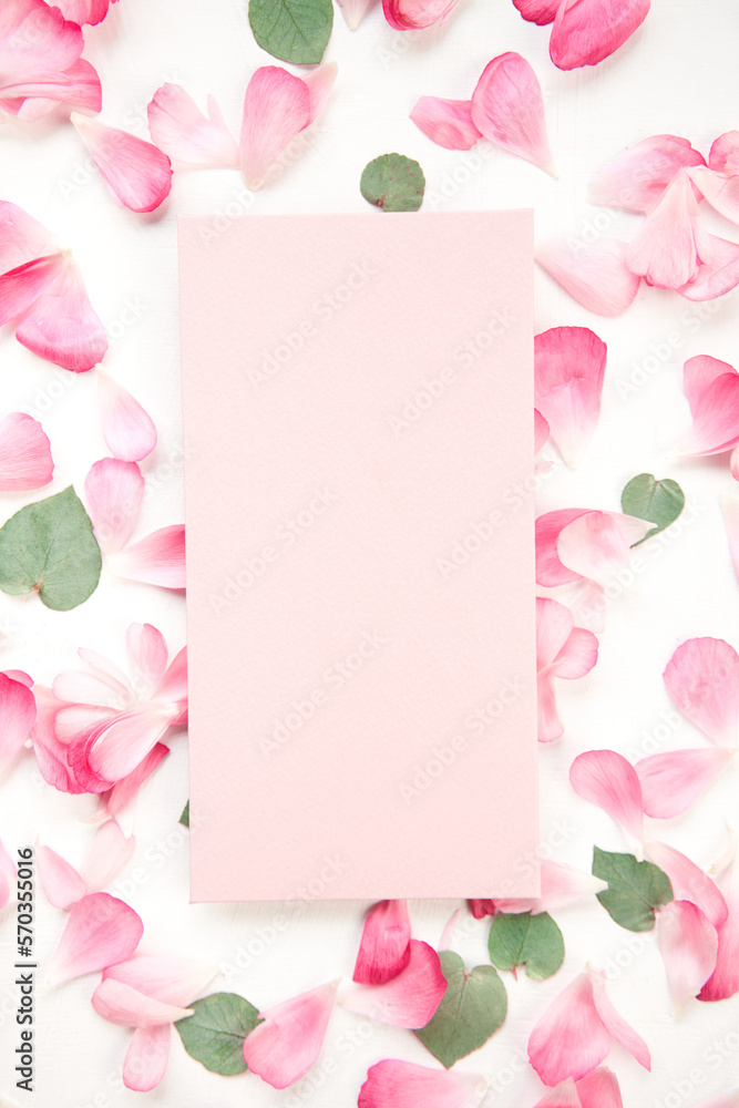 Love letter. card with pink paper envelope mock up. Petals of flowers, roses and ranunculus. Valenti