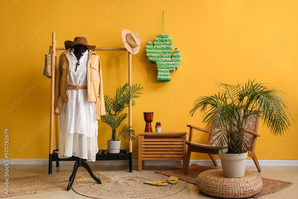 Interior of fashion designers studio with mannequin, clothes and pinata