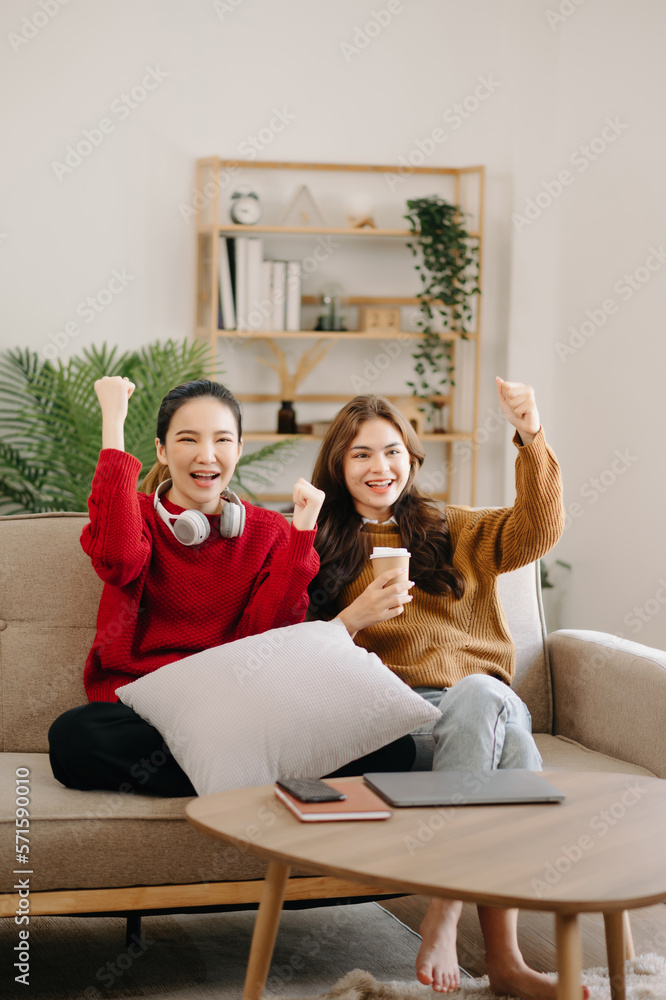 Two asian beauty smiling young women sitting on sofa Attractive casual girl feel happy and relax,hav