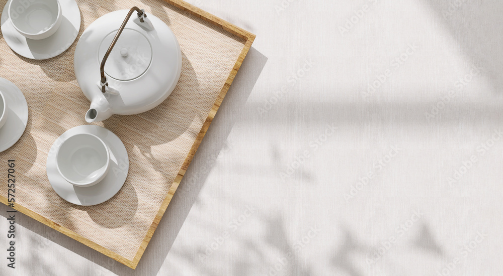 Top view of modern, minimal, beautiful white ceramic teapot, teacup with saucer on brown straw mat w