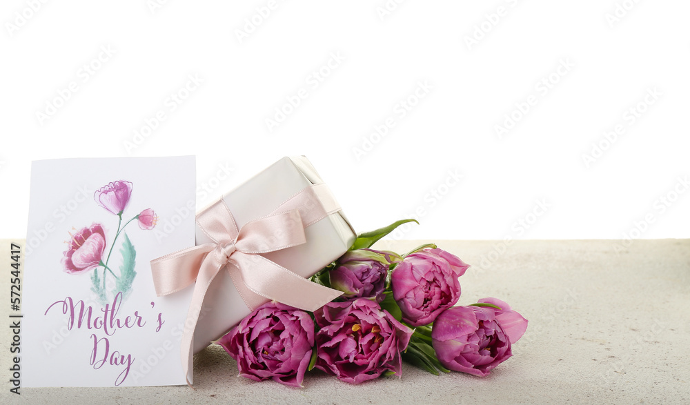 Greeting card with text MOTHERS DAY, tulips and gift on table against white background