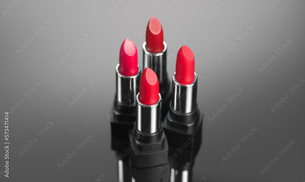 Lipstick. Fashion red Colorful Lipsticks over dark background. Red matte lipstick tints palette, Pro