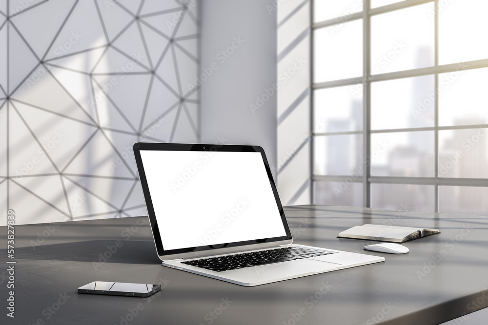 Perspective view on blank white modern laptop screen with place for your logo or text on dark table 