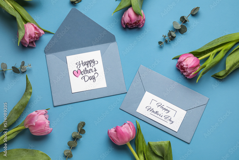Composition with greeting cards and beautiful tulip flowers on color background. Mothers day celebr