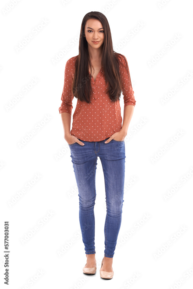 A young fashion female model or a fashionable woman standing with her hands in pocket  and posing re