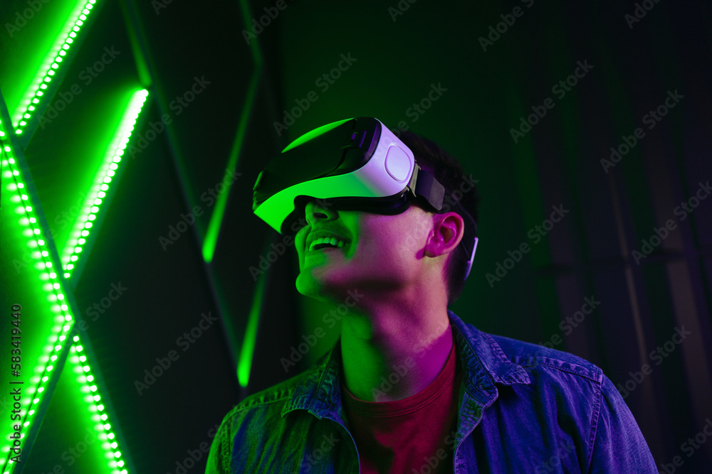 Man watching a Vr game using virtual reality goggles