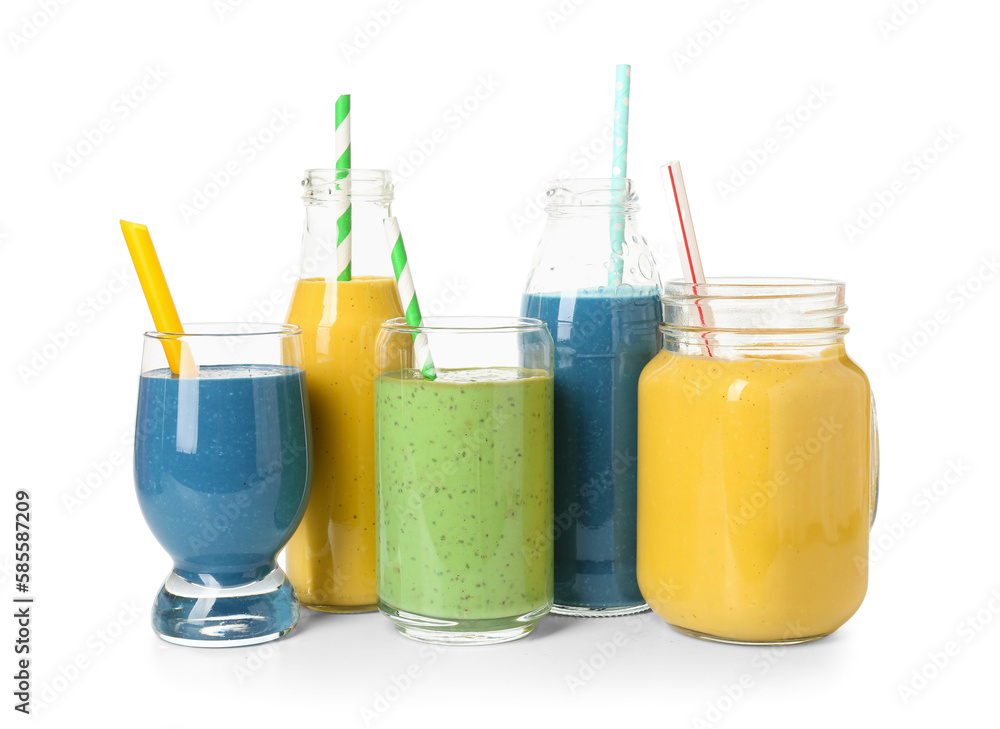 Glasses and bottles of different tasty smoothie with straws on white background