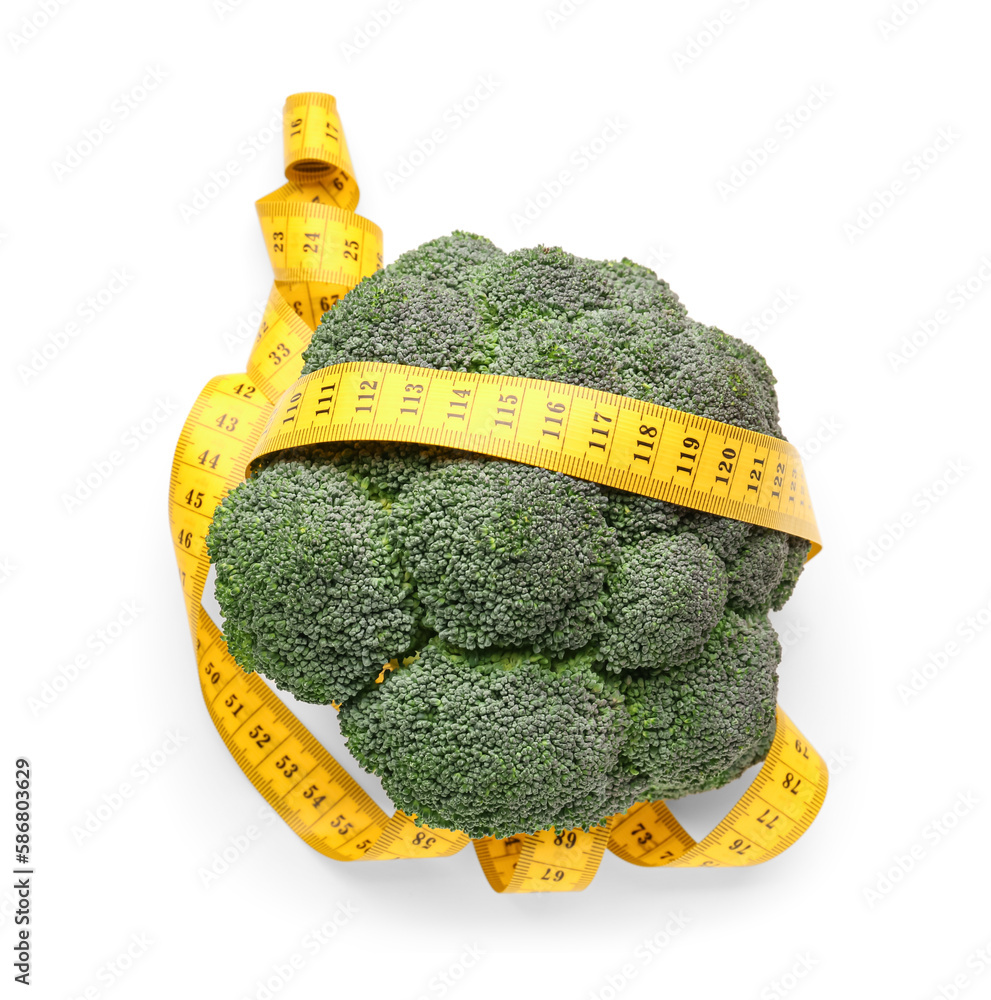 Broccoli and yellow measuring tape on white background. Diet concept
