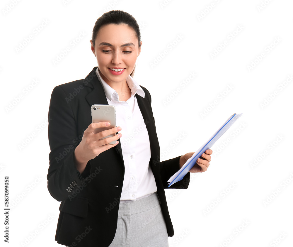 Female business consultant with clipboard using mobile phone on white background