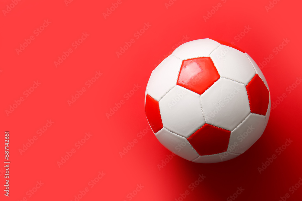 Soccer ball on red background