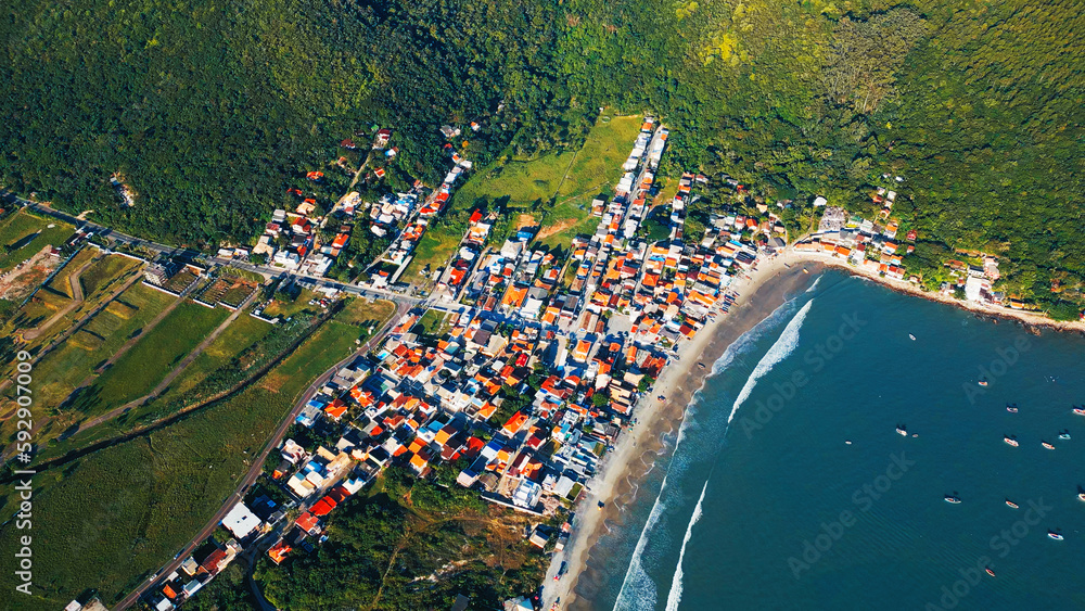 Aerial view of the Brazilian coastline and the little fishermans town in Santa Catarina, Brazil