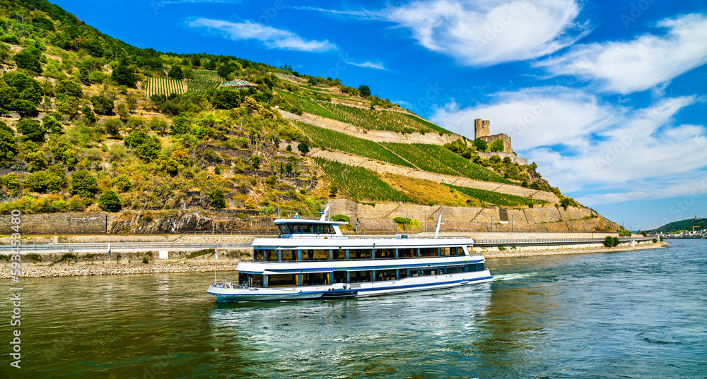 Cruise ship at Ehrenfels Castle in the Upper Middle Rhine Valley. UNESCO world heritage in Germany