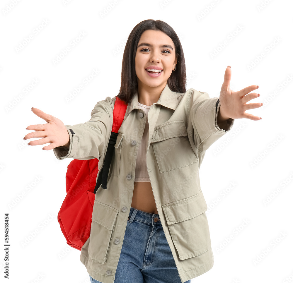 Young female student opening arms for hug on white background