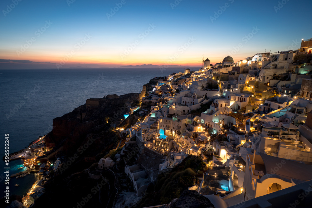 Blue hour sunset view at Oia Coastal Town, Tholos, Santorini in Greece. 