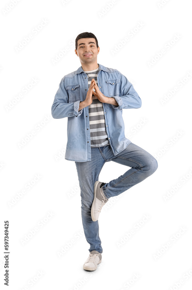 Young man meditating on white background. Balance concept
