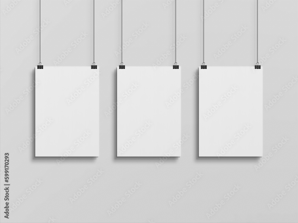 Three Blank vertical poster hanging with clips on a wall Mockup. 3D rendrering