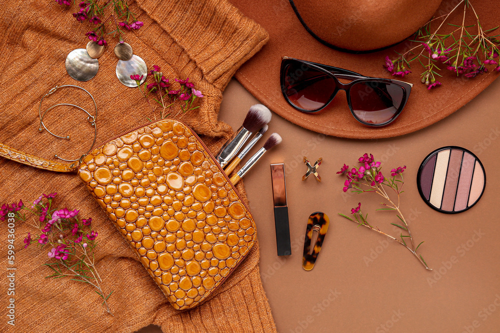 Composition with stylish female accessories, cosmetics, clothes and flowers on color background