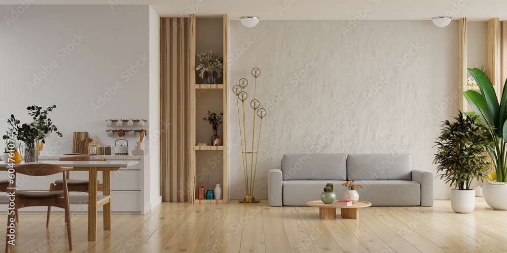 Living room interior wall mockup in warm tones with gray sofa which is behind the dining room.3d ren