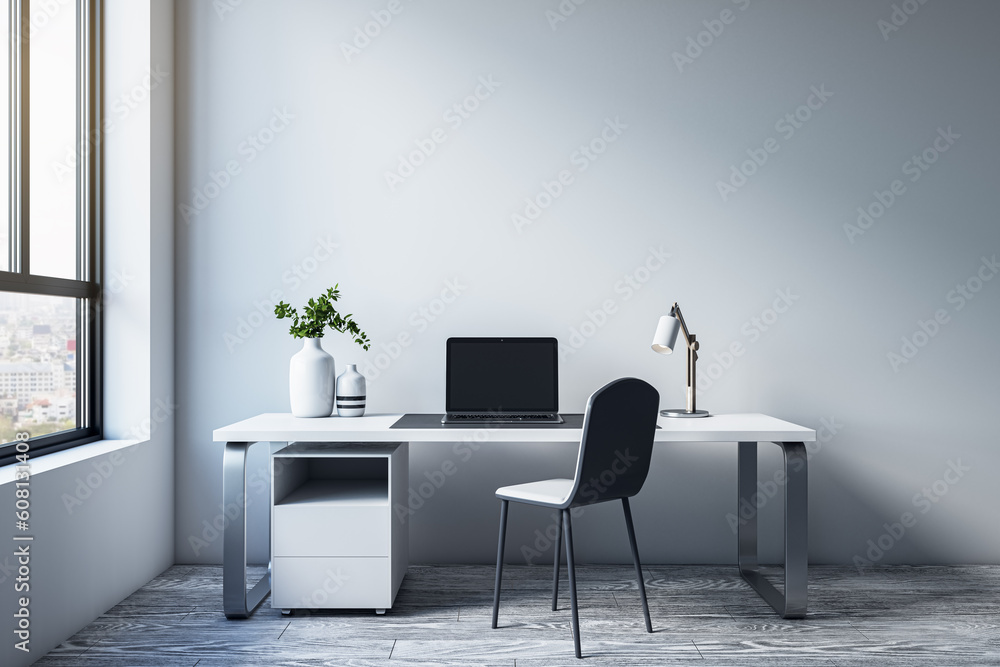 Modern simple office interior with furniture, equipment, decorative items and window with city view.