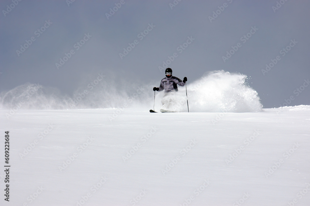 Skiing fresh tracks in deep powder