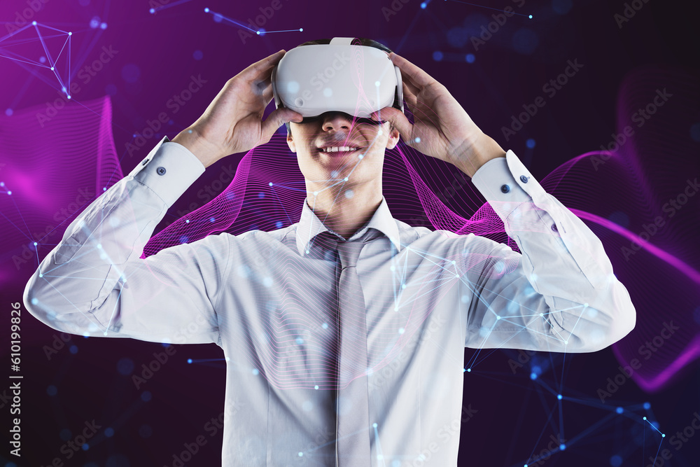 Attractive young man with VR glasses on creative glowing purple metaverse space background. Abstract