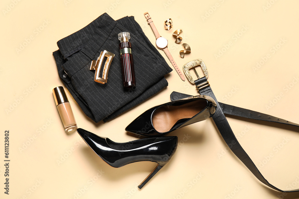 Composition with stylish heels, clothes, cosmetics and accessories on color background