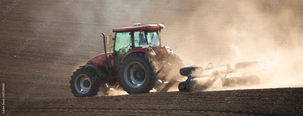 Tilling the soil: a tractor cultivator in action