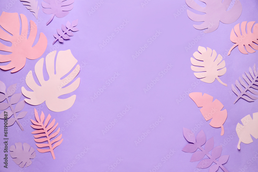 Frame made of different paper tropical leaves on lilac background
