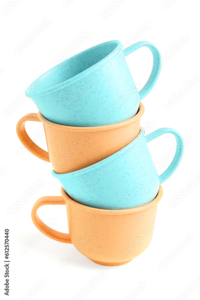 Colorful cups isolated on white background. Childrens Day celebration