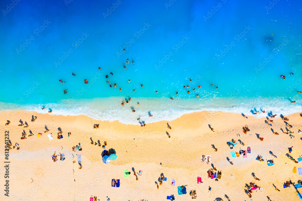 A drone view of the beach and the sea. People on vacation. Vacation and holidays. Summer time for se