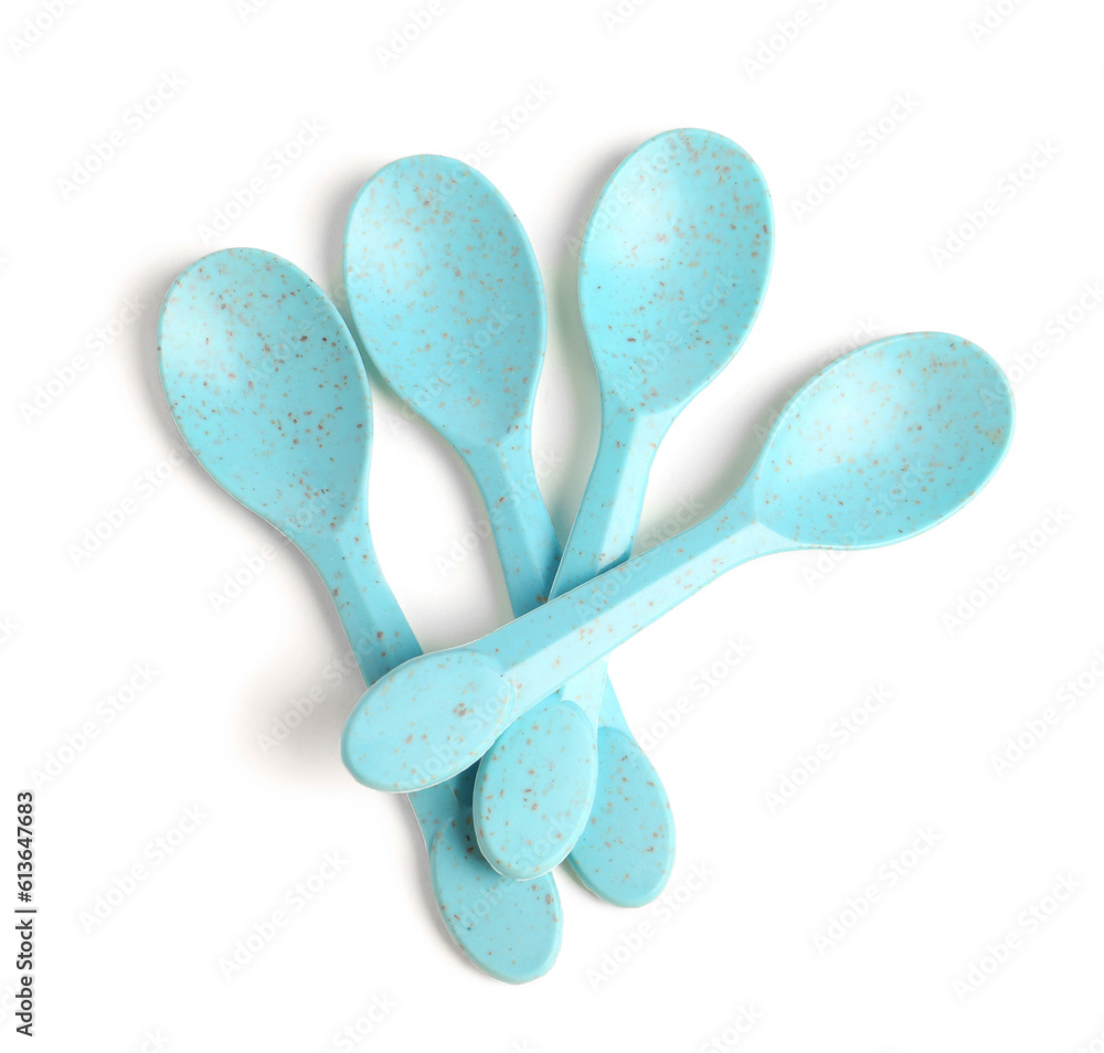 Blue spoons isolated on white background. Childrens Day celebration