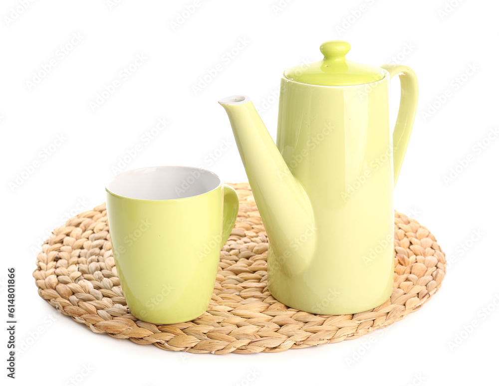 Wicker mat with teapot and mug isolated on white background