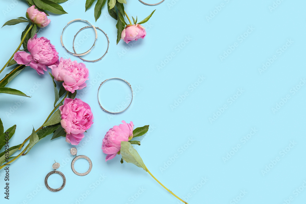 Composition with beautiful peony flowers and stylish female accessories on color background