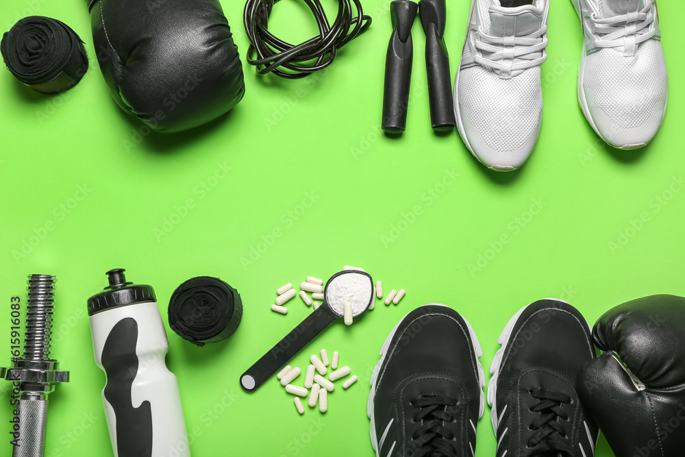 Composition with sports equipment, shoes and amino acid supplements on green background