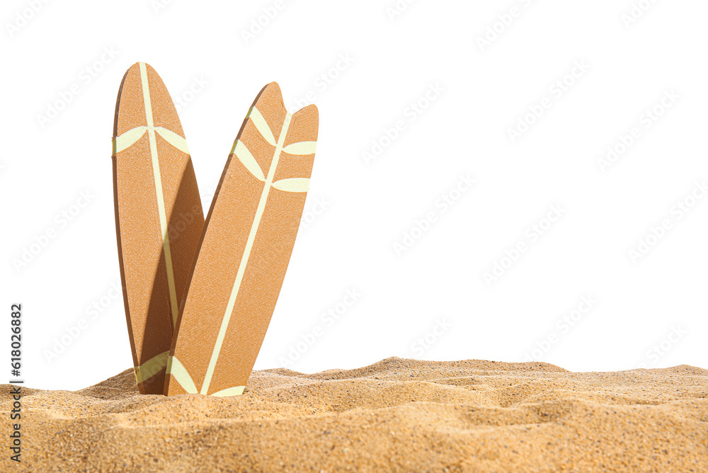 Mini surfboards on sand against white background