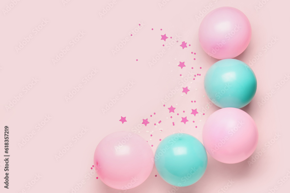 Blue and pink balloons with serpentine on color background