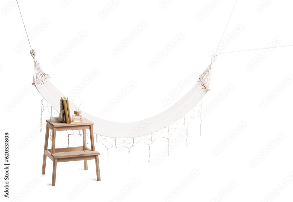 Cozy hammock, stepladder with books and reed diffuser isolated on white background