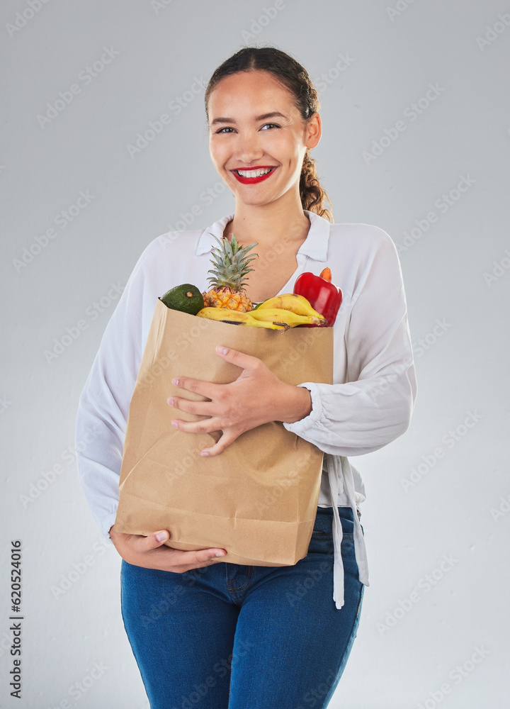 Portrait, smile and woman with grocery bag, fruit and sales in studio isolated on a white background