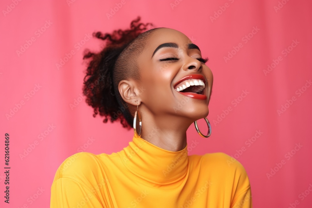 Happy African American woman on pink background.