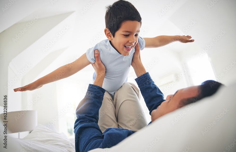 Airplane, game and happy boy child with father on a bed with love, bonding and having fun in their h