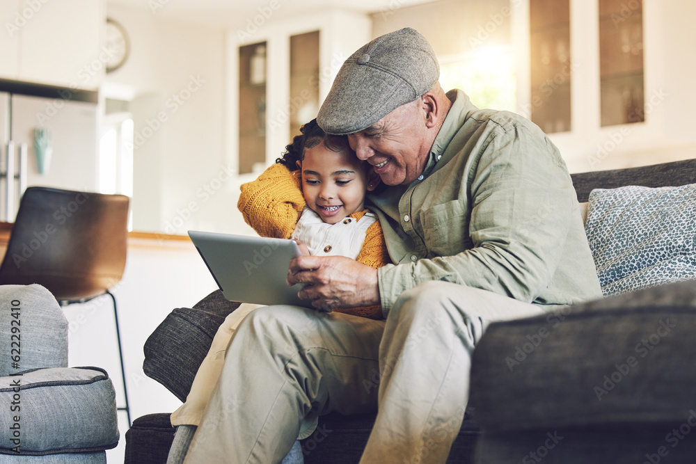Girl kid, grandfather with tablet on sofa and relax together, watch cartoon or elearning games at ho