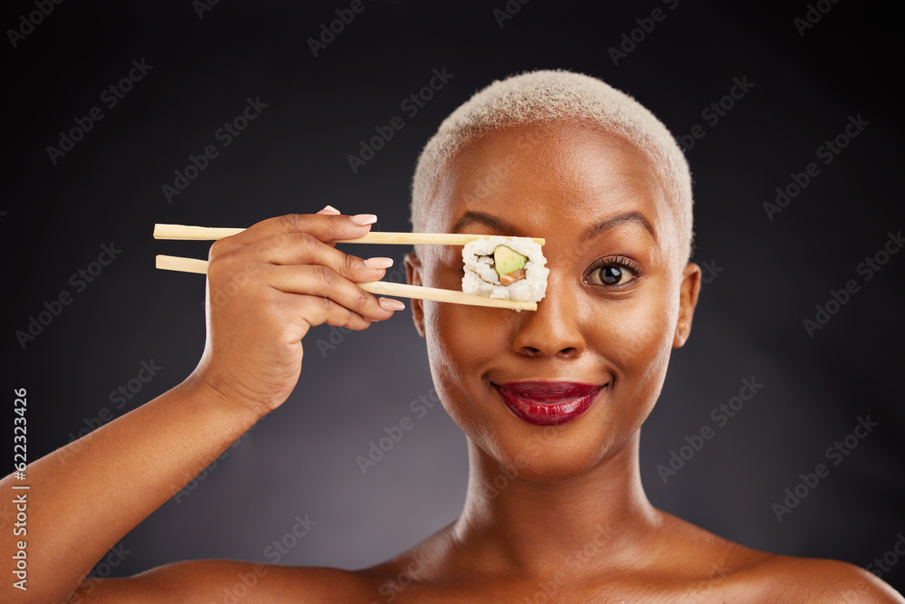 Woman, face and sushi with chopsticks in studio for healthy eating, beauty and food. Portrait of a b