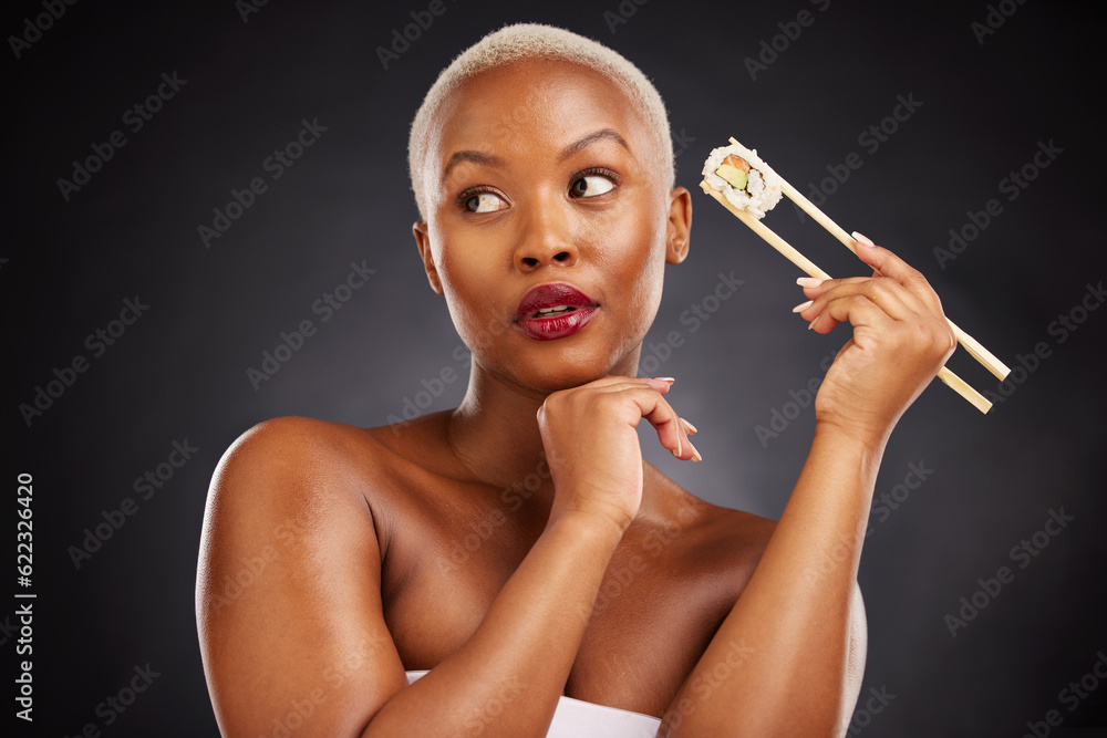 Face, thinking and woman with sushi and chopsticks in studio for healthy eating, beauty or food. Bla