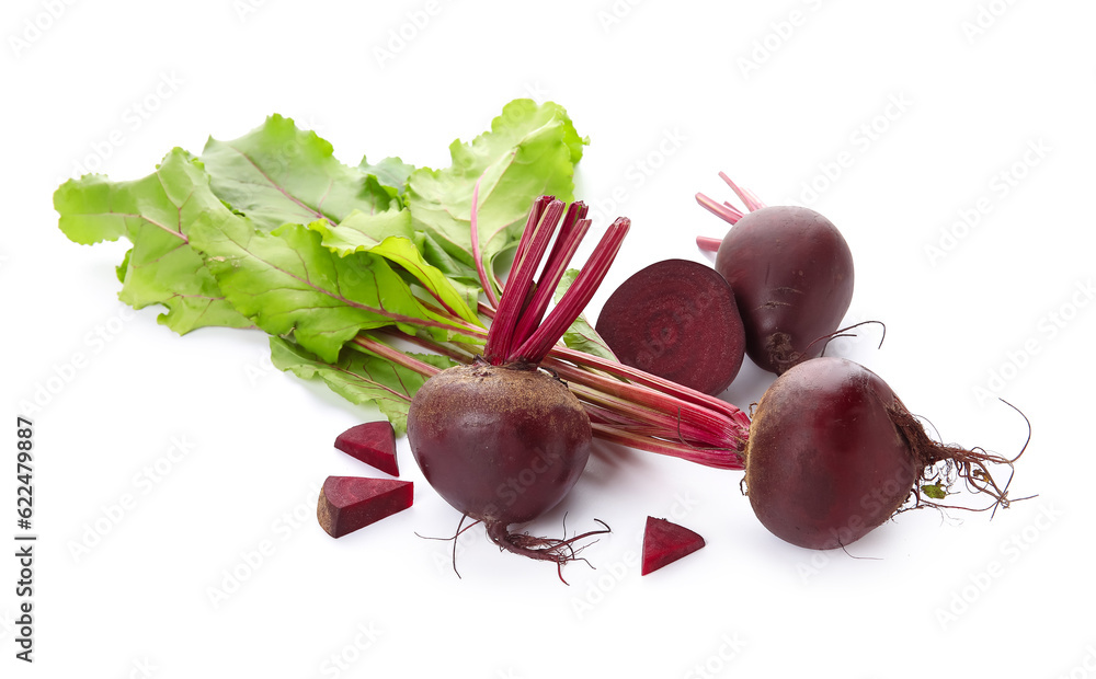Fresh beets with green leaves on white background