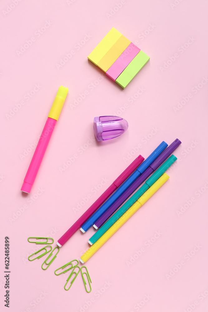 Stationery in shape of rocket on pink background