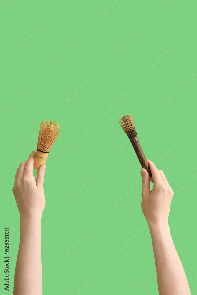 Woman with bamboo chasens on green background